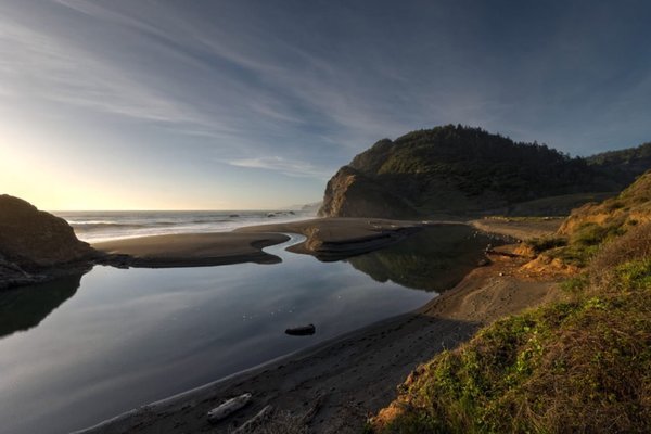 The lost coast trail is defined by black sand beaches and rocky outcroppings