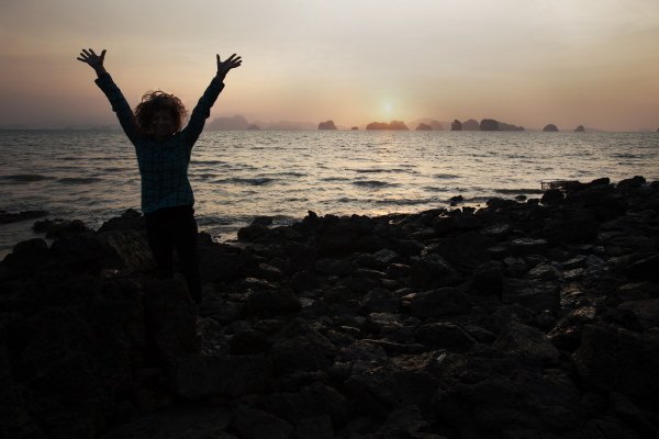 Abbey Smith enjoys the sunset during a deep water soloing trip to Lao Liang, Thailand