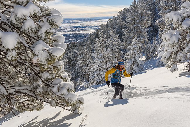 Anton Krupicka uses trekking poles to aid in deep snow up on Green Mountain in Boulder, Colorado