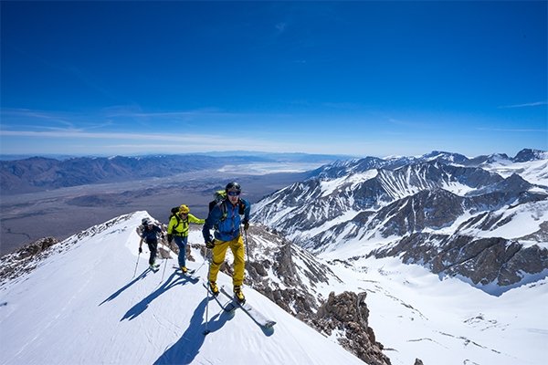 three backcountry skiers