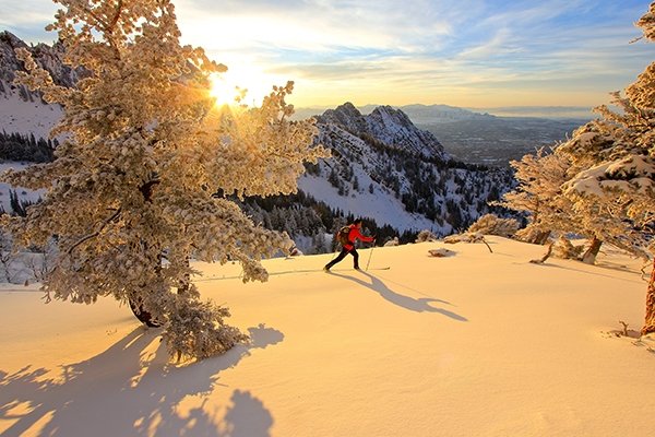 Skiing in the backcountry during sunrise