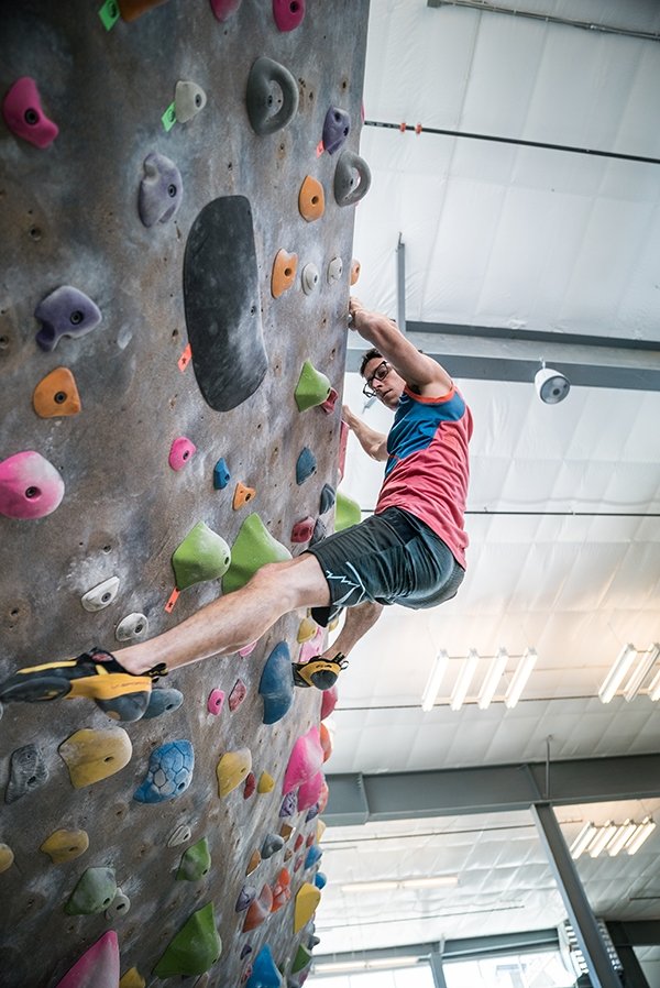 Climber in gym working on technique