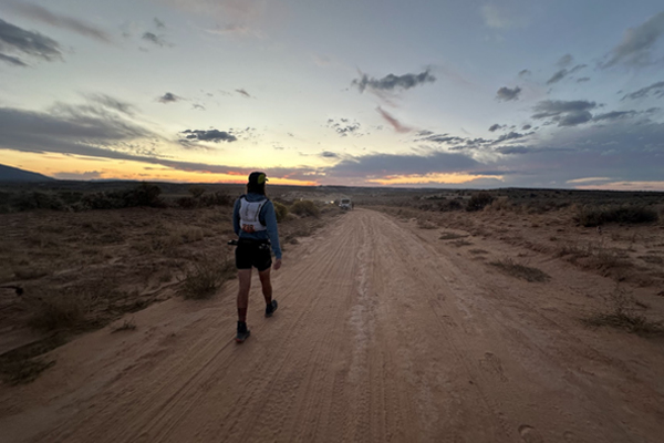 Jason Thienel on trail at sunset