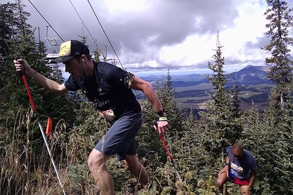 Atheletes VK training by doing some steep hiking 