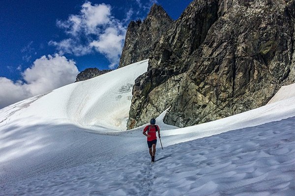 Nick Elson running across the Dione Glacier