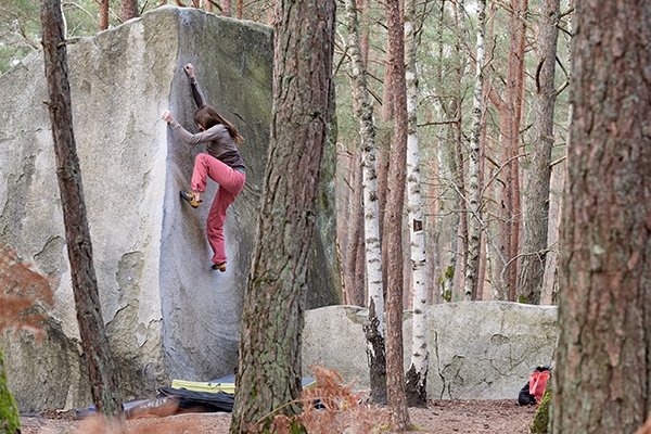 Paige Claassen working a technical arete in Fontainebleau