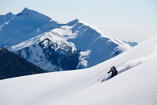 La Sportiva Ski Athlete Kylee Toth Ohler skiing fresh powder in BC.