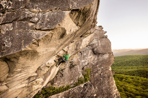 Sam Dospoy climbing in the Southeast