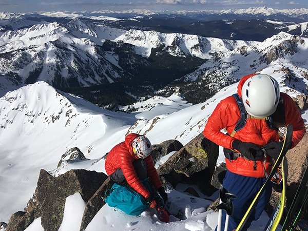 Putting on crampons for the traverse over to our descent off Silverthorne
