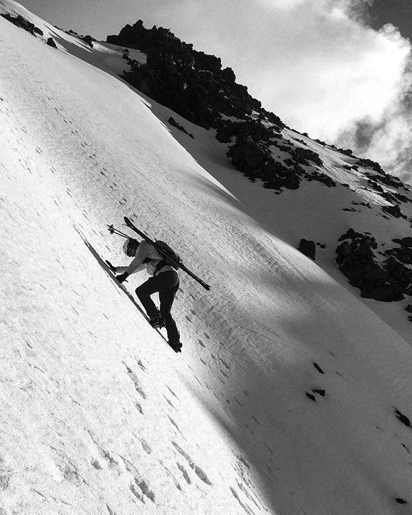 Chris downclimbs the frozen upper slopes of Silverthorne Peak.